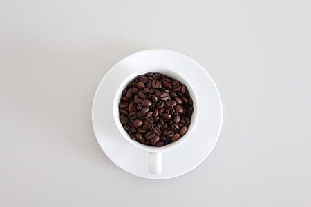 cup of mug filled with coffee beans thumbnail