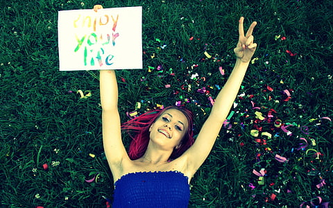 photo of woman lying on grass thumbnail