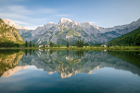 landscape photography of mountain surrounded with body of water thumbnail