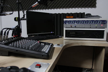 black audio mixer on beige wooden desk thumbnail