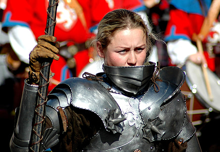 woman wearing silver-colored knight armor while holding spear thumbnail