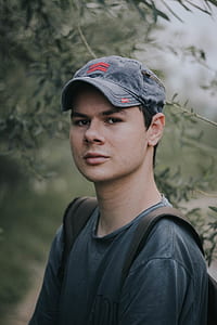 man wearing blue denim cadet cap thumbnail