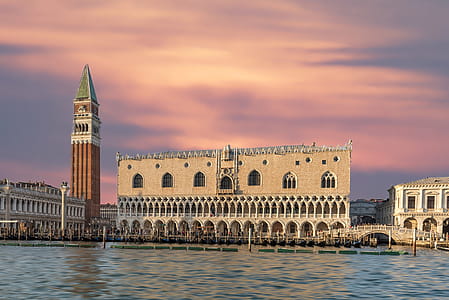 Brown Building With Body of Water thumbnail