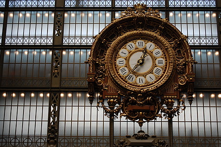 round brown wall clock inside building thumbnail