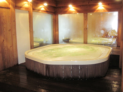 white hot tub with brown wooden frame thumbnail