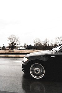 black BMW 1-series on road thumbnail