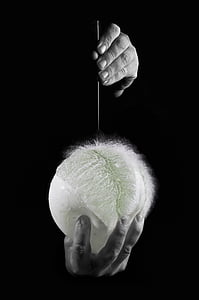 grayscale photo of person holding needle and balloon thumbnail