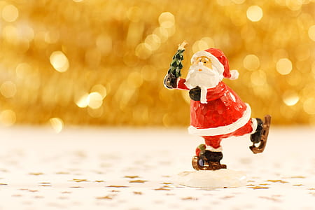 selective focus photography of Santa Claus figurine thumbnail