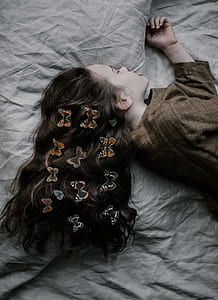 woman laying down on gray mattress thumbnail
