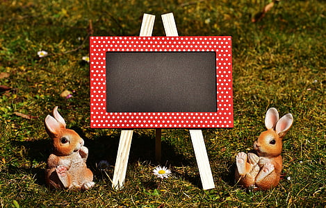 chalkboard and two rabbit figurines thumbnail