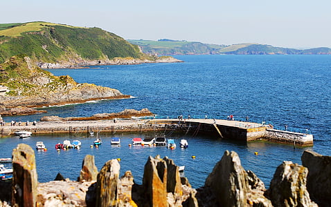 aerial photography of boats docked near wall thumbnail