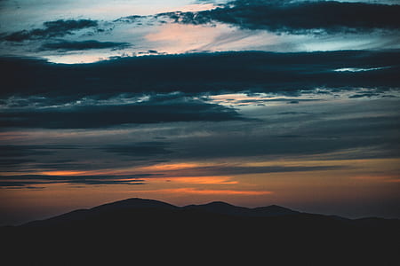mountains under cloudy sky thumbnail
