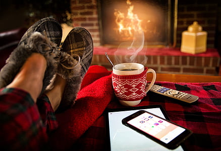 white ceramic mug beside gray remote control thumbnail