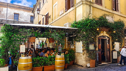 two brown wooden wine barrels placed near restaurant thumbnail