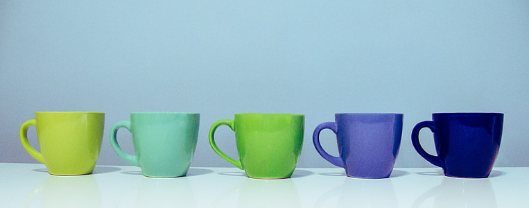 five assorted-color ceramic mugs thumbnail