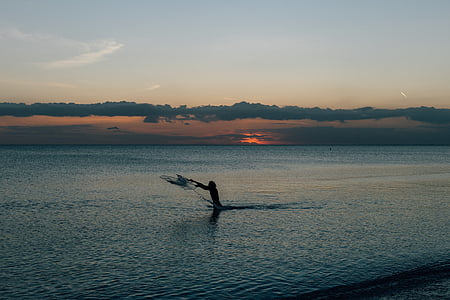 photo of person on body of water thumbnail