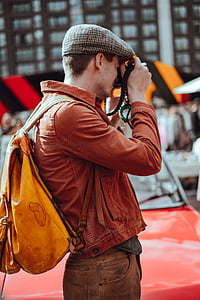 man holding camera during daytime thumbnail