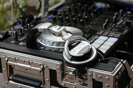 selective focus photography of black and silver Xona headphones and terminal mixer thumbnail