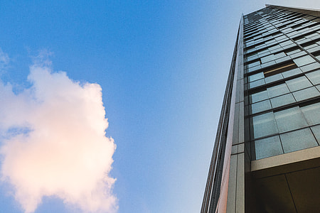 Glass Skyscraper Building and Clouds thumbnail