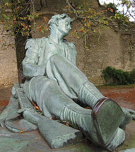 man sitting near rifle statue thumbnail