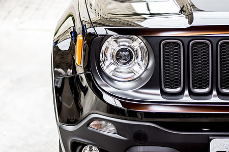 close-up photo of black Jeep Renegade headlight thumbnail