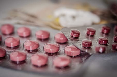 depth of field photography of red blister pack thumbnail