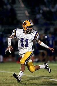 football player wearing white jersey shirt running on field thumbnail