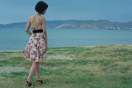 Woman Wearing Pink and White Floral Halter-top Mini Dress thumbnail