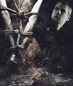 grayscale man and rope photo thumbnail