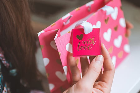 Valentine’s Day, Woman received a gift in a pink small bag from love thumbnail