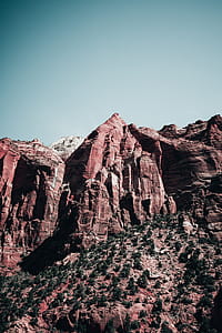 Grand canyon sandstone peaks under clear sky and bright sunlight thumbnail