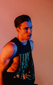 man wearing black sleeveless top thumbnail