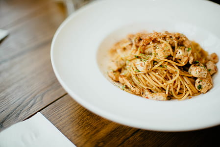 round white ceramic plate with pasta on top thumbnail