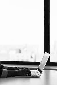 Gray Laptop Computer on White Surface thumbnail