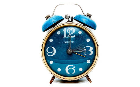 brown and blue alarm clock at 12:15 thumbnail