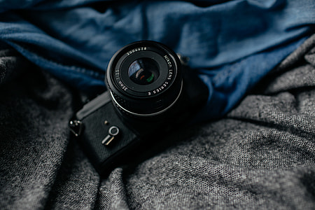 black DSLR camera thumbnail