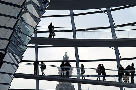 people standing near glass window thumbnail