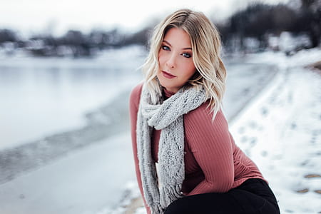 focus photo of woman wearing red long-sleeved shirt thumbnail