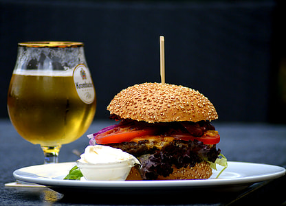 hamburger with vegetables near champagne glass close-up photo thumbnail