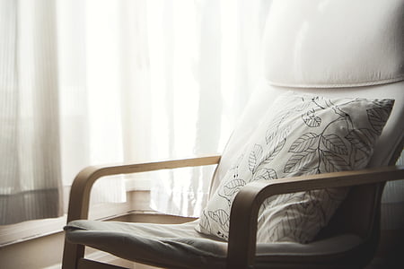 silhouette photography of armchair and throw pillow indoors thumbnail