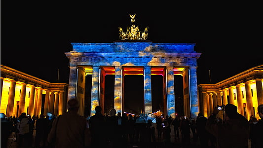 people at Brandenburg Gate at night thumbnail