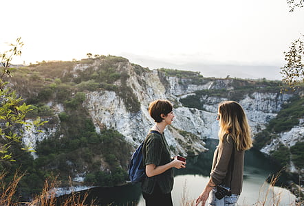 two women on top of cliff thumbnail