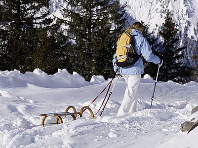 man walking on snow covered ground thumbnail