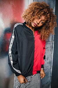 Woman Wearing Black and Red Zip-up Jacket thumbnail