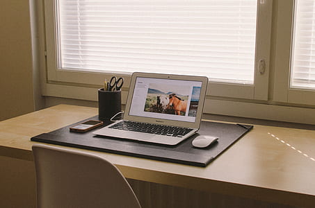 MacBook Air beside magic mouse thumbnail
