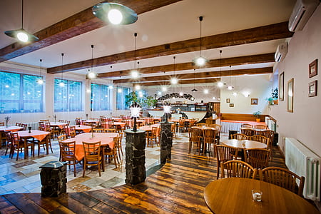brown wooden dining table and chair beside wall thumbnail
