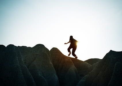 girl climbing on hill silhouette thumbnail