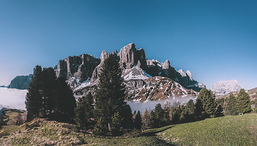 rock mountains under blue sky at daytime thumbnail