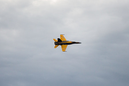 yellow and black fighter jet flying on sky thumbnail