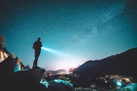 man standing on rock formation thumbnail